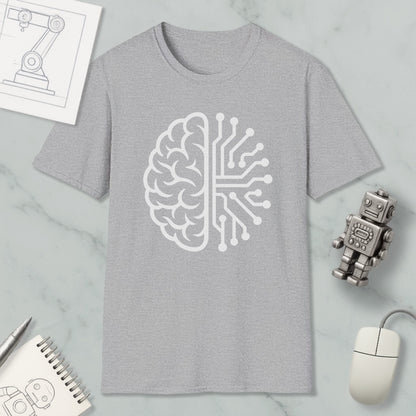 a gray t-shirt with a white graphic design depicting a brain and a circuit board, along with various objects such as a robot, a mouse, and a notebook.