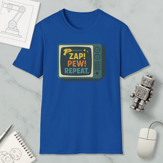 a blue t-shirt with a graphic design, a computer mouse, a notebook, and a small robot on a marble surface.
