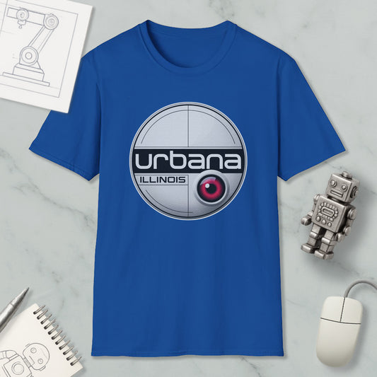 a blue t-shirt with a circular logo, a computer mouse, a notebook, and a small robot on a marble surface.