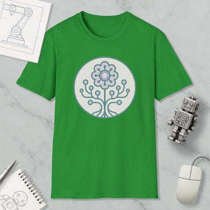 a green t-shirt with a graphic design of a flower and a tree on it, along with a computer mouse, a notebook, and a robot figurine.