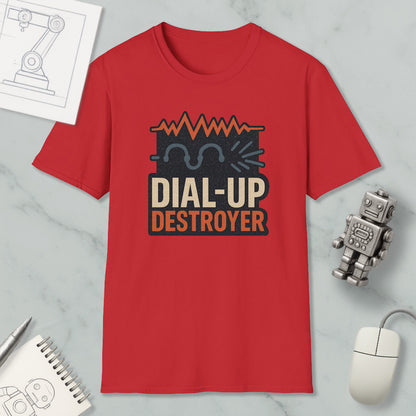 a red t-shirt with a graphic design, a computer mouse, a notebook, and a small robot on a marble surface.