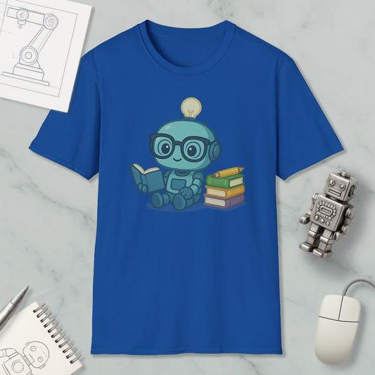 a blue t-shirt with a cartoon robot sitting and reading a book, surrounded by various objects such as a computer mouse, a keyboard, and a stack of books.