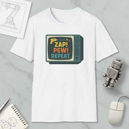 a white t-shirt with a colorful graphic design, a computer mouse, a pen, a notebook, and a small robot on a marble surface.