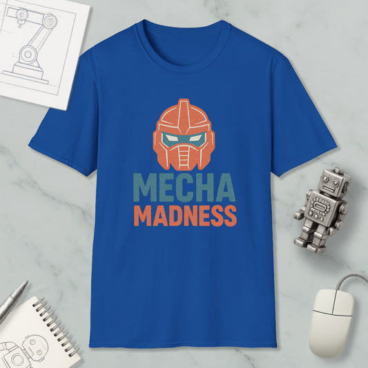 a blue t-shirt with a graphic design of a robot's head and the text "MECHA MADNESS" printed on it, along with a computer mouse and a notebook.