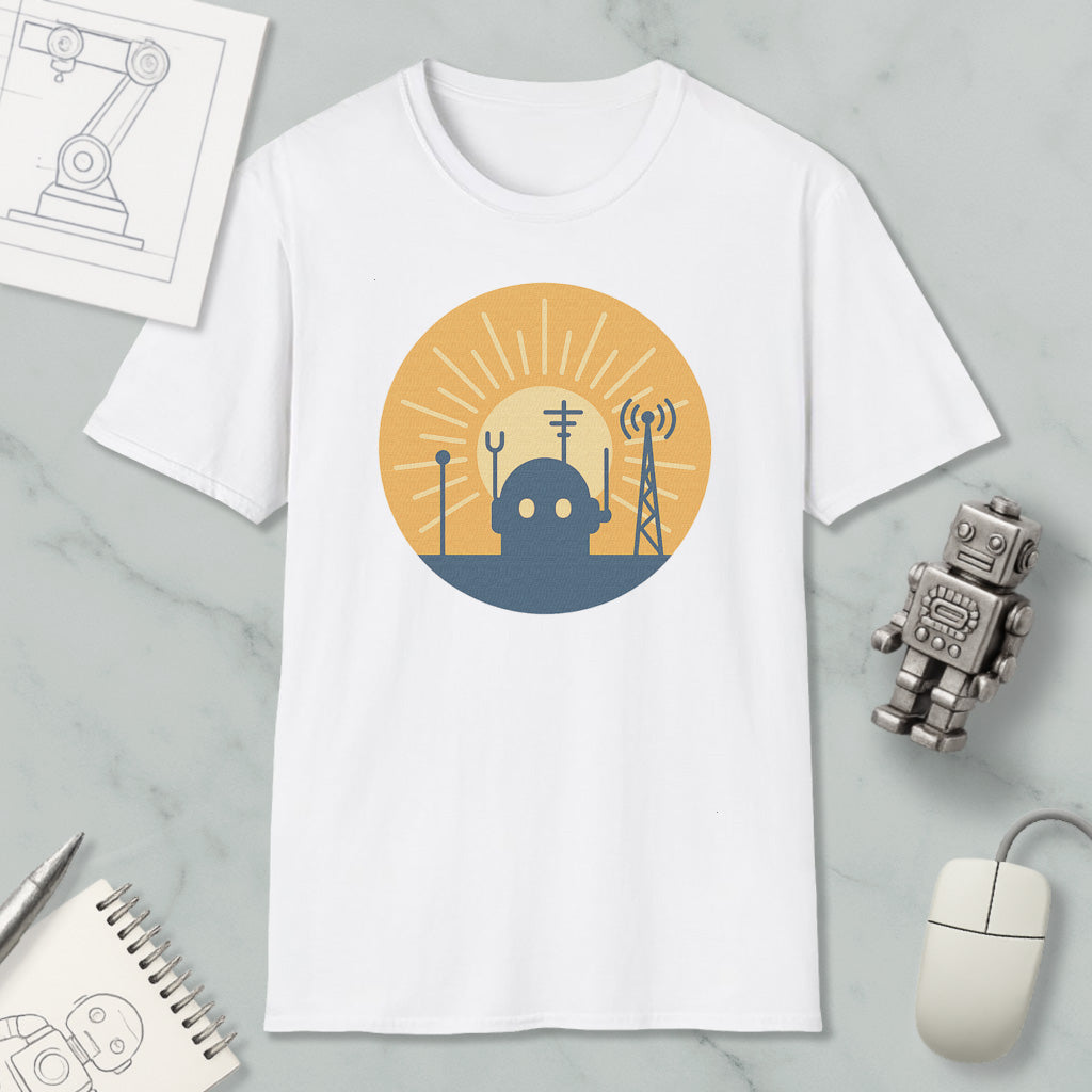 a white t-shirt with a graphic design depicting a robot and various technological elements, such as a tower and antenna, set against a sun-like background.