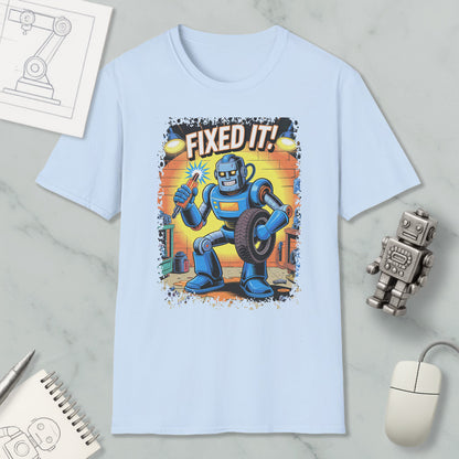 A light blue t-shirt with a graphic of a robot holding a wrench and the text "FIXED IT!"