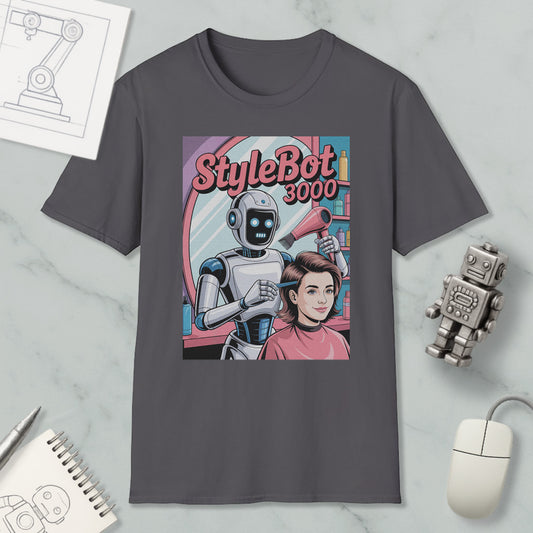a t-shirt with a graphic design depicting a robot hairdresser styling a woman's hair. The t-shirt is placed on a marble surface, surrounded by various objects such as a computer mouse, a notebook, and a toy robot.