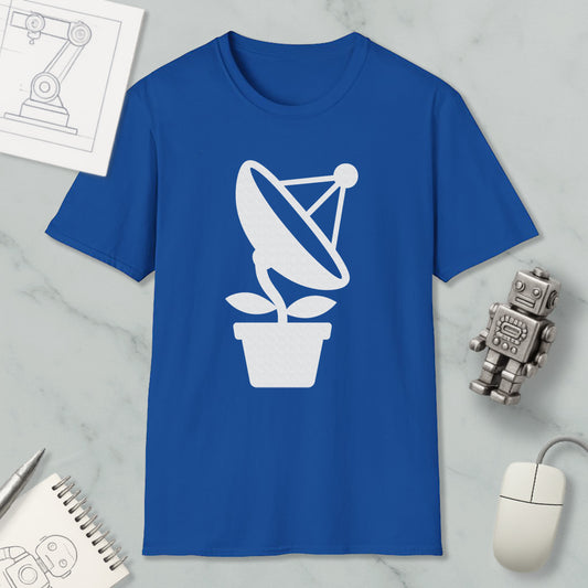 a blue t-shirt with a white satellite dish graphic, a small robot, a mouse, and a notebook on a marble surface.