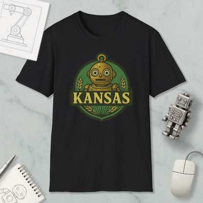 a black t-shirt with a graphic design of a robot and the word "KANSAS" printed on it, along with a small robot figurine and a computer mouse.