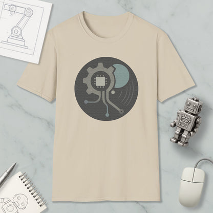 a beige t-shirt with a graphic design, a small robot, a computer mouse, and a notebook on a marble surface.