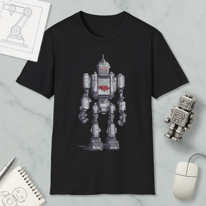 a black t-shirt with a pixelated robot design, along with a computer mouse, a notepad, and a pen on a marble surface.