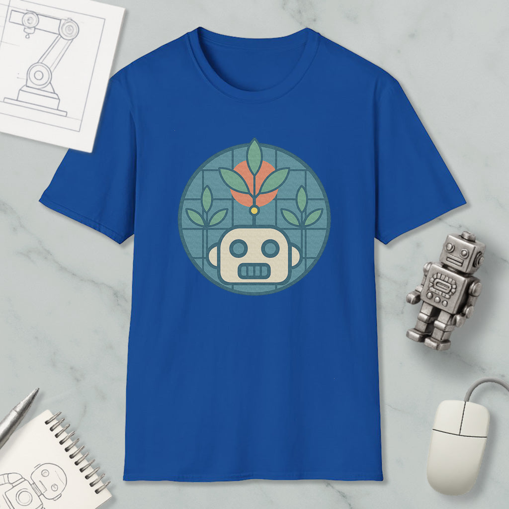 a blue t-shirt with a graphic design of a robot and plants, along with a computer mouse and a notebook on a marble surface.