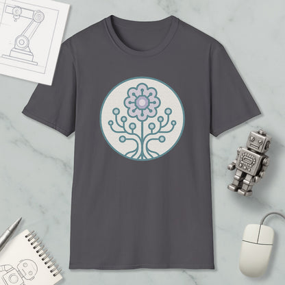 a gray t-shirt with a circular design on it, surrounded by various objects such as a computer mouse, a robot, and a notebook.