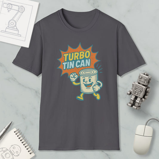 a gray t-shirt with a graphic design depicting a tin can character with a surprised expression, accompanied by the text "TURBO TIN CAN". The t-shirt is displayed on a marble surface, along with a computer mouse, a notebook, and a small robot figurine.