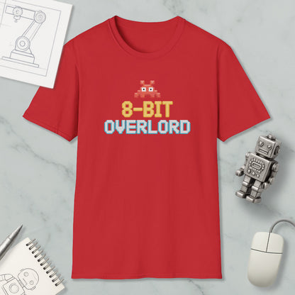 a red t-shirt with a pixelated character and text, along with various objects such as a computer mouse, a robot, and a notebook.