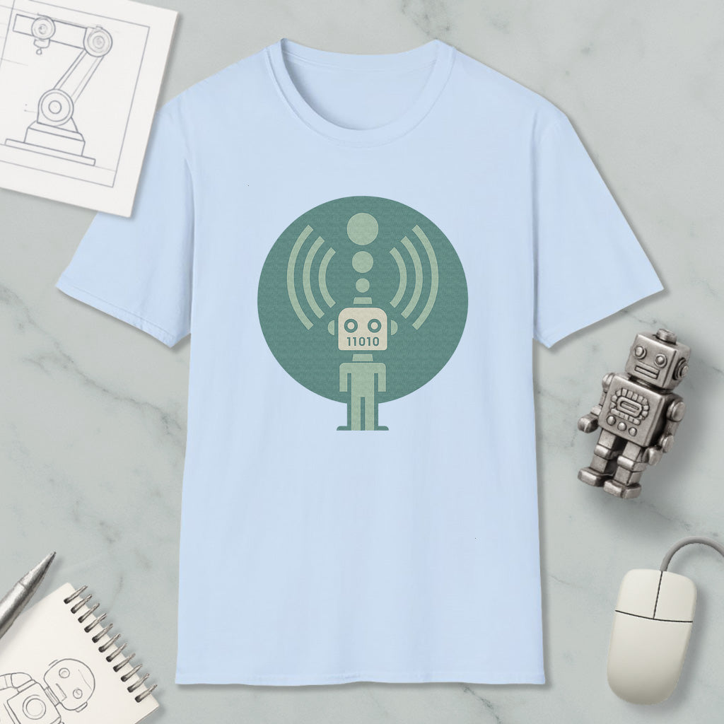 a light blue t-shirt with a graphic design of a robot, along with various objects such as a computer mouse, a notebook, and a pen.