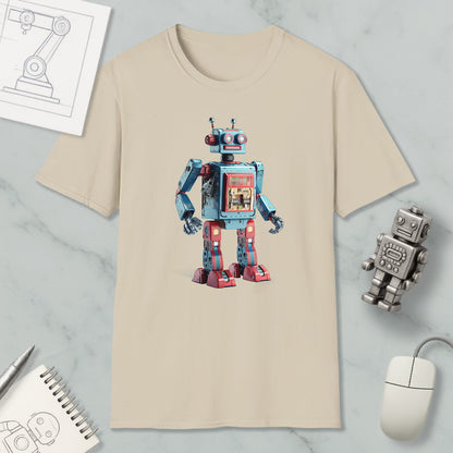 a beige t-shirt with a colorful robot design printed on it, along with various objects such as a computer mouse, a pen, and a notebook.