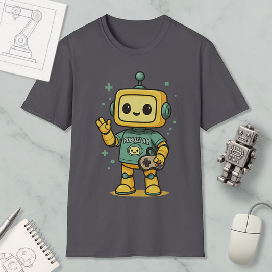 a gray t-shirt with a cartoon robot character wearing a green shirt and holding a game controller. The t-shirt is displayed on a marble surface, along with a computer mouse, a notebook, and a small robot figurine.