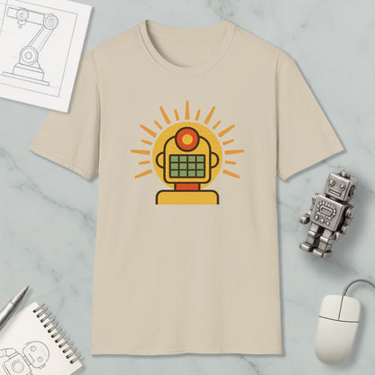 a beige t-shirt with a yellow robot graphic, a computer mouse, a notebook, and a small robot figurine on a marble surface.