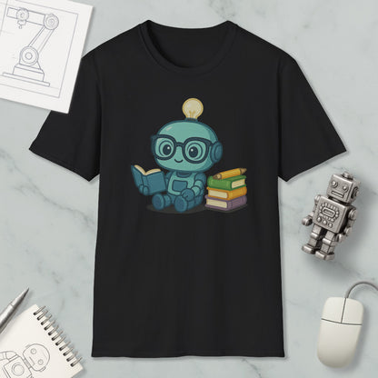 A black t-shirt with a cartoon robot character reading a book, surrounded by various objects such as a computer mouse, a notebook, and a robot figurine.
