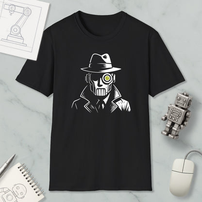 a black t-shirt with a white graphic design depicting a man wearing a hat and a mask, with a yellow eye patch. The t-shirt is placed on a marble surface, along with a computer mouse, a pen, and a notebook.
