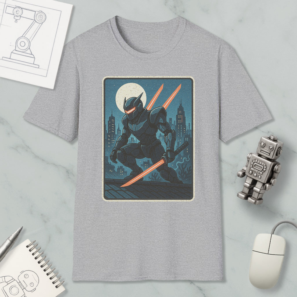 a gray t-shirt with a graphic design depicting a robot or character holding a sword and standing on a rooftop at night. The t-shirt is surrounded by various objects, including a computer mouse, a notebook, and a robot figurine.