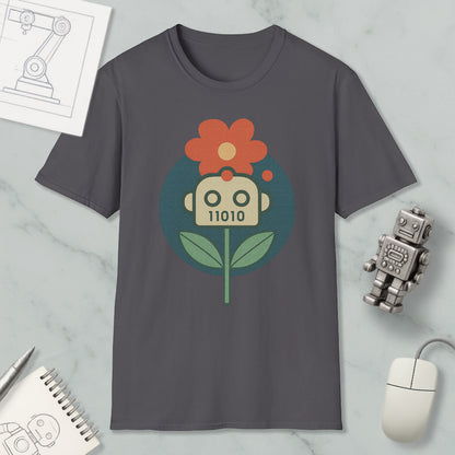 a gray t-shirt with a graphic design of a flower and a robot, along with various objects such as a computer mouse, a notebook, and a robot figurine.