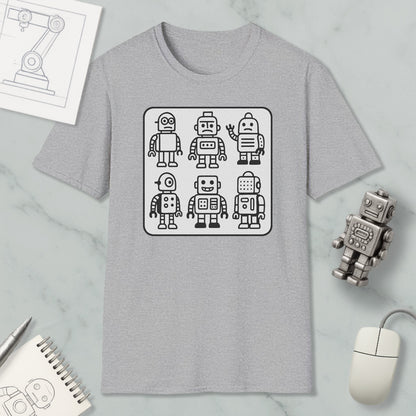 a gray t-shirt with a graphic design of six cartoon-style robots, along with a computer mouse and a notebook on a marble surface.