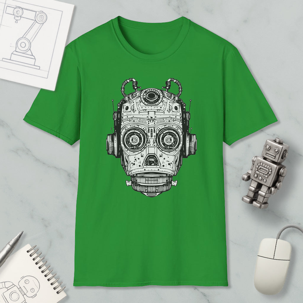 a green t-shirt with a graphic of a robot or mechanical head, along with various objects such as a computer mouse, a notebook, and a pen.