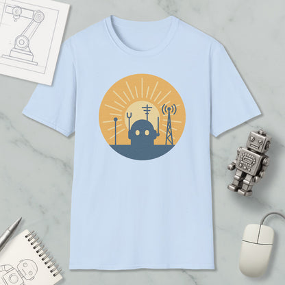 a light blue t-shirt with a graphic design depicting a robot and various technological elements, such as a tower and antenna, set against a sun-like background.