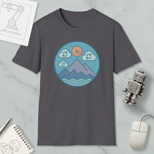 a gray t-shirt with a circular graphic design depicting mountains, clouds, and a sun, along with a robot and a computer mouse.