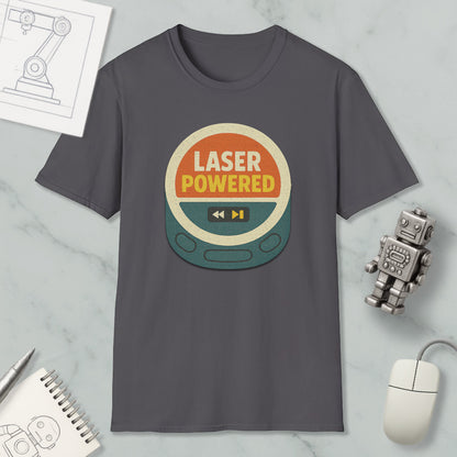 a gray t-shirt with a graphic design that says "LASER POWERED" in bold letters, surrounded by a circular shape with a play button and a speaker icon. The t-shirt is displayed on a marble surface, along with a small robot toy and a computer mouse.