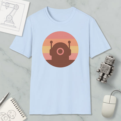 a light blue t-shirt with a circular graphic design, a small robot figurine, a computer mouse, and a notebook on a marble surface.