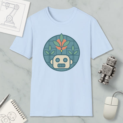 a light blue t-shirt with a graphic design of a robot and plants, along with a computer mouse and a notebook on a marble surface.