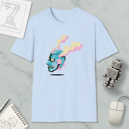 a light blue t-shirt with a colorful graphic design, including a robot or robot-like figure with a face and smoke coming out of its head. The t-shirt is placed on a marble surface, along with a computer mouse, a spiral notebook, and a small robot figurine.