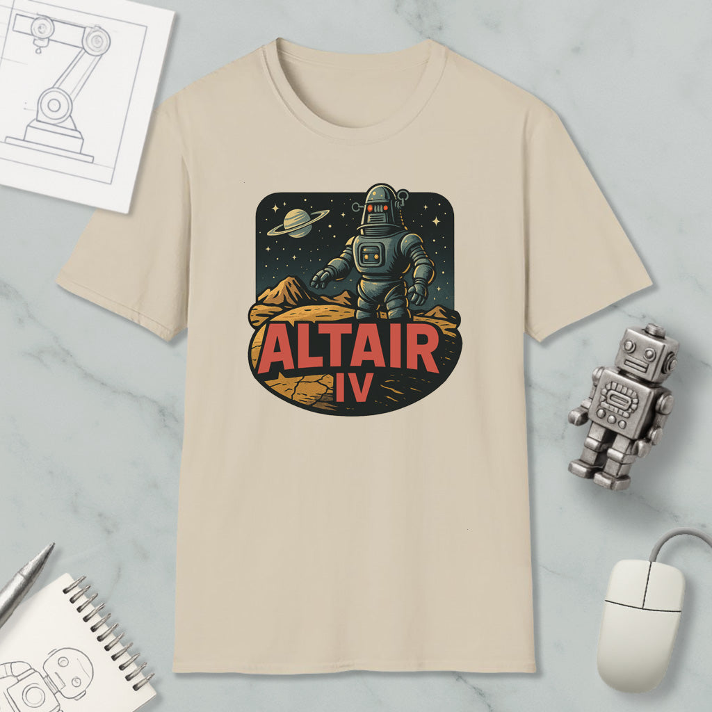 a beige t-shirt with a graphic design depicting a robot standing on a rocky surface with a planet in the background, along with the text "ALT AIR IV".