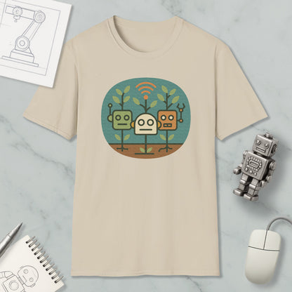 a beige t-shirt with a graphic design of three cartoon robots, along with a computer mouse, a notebook, and a pen on a marble surface.
