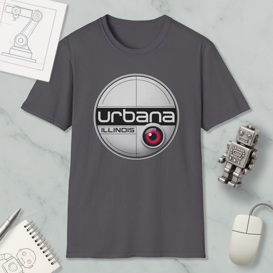 a gray t-shirt with a circular logo, a computer mouse, a notebook, and a small robot on a marble surface.