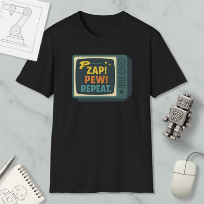 a black t-shirt with a colorful graphic design, a computer mouse, a notebook, and a small robot on a marble surface.