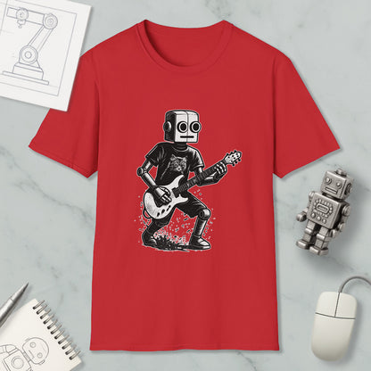 a red t-shirt with a graphic of a robot playing a guitar, along with a computer mouse, a notebook, and a robot figurine.