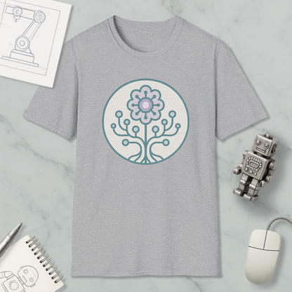 a gray t-shirt with a circular design on it, surrounded by various objects such as a computer mouse, a robot, and a notebook.