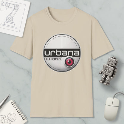 a beige t-shirt with a circular logo, a computer mouse, a robot, and some papers on a marble surface.