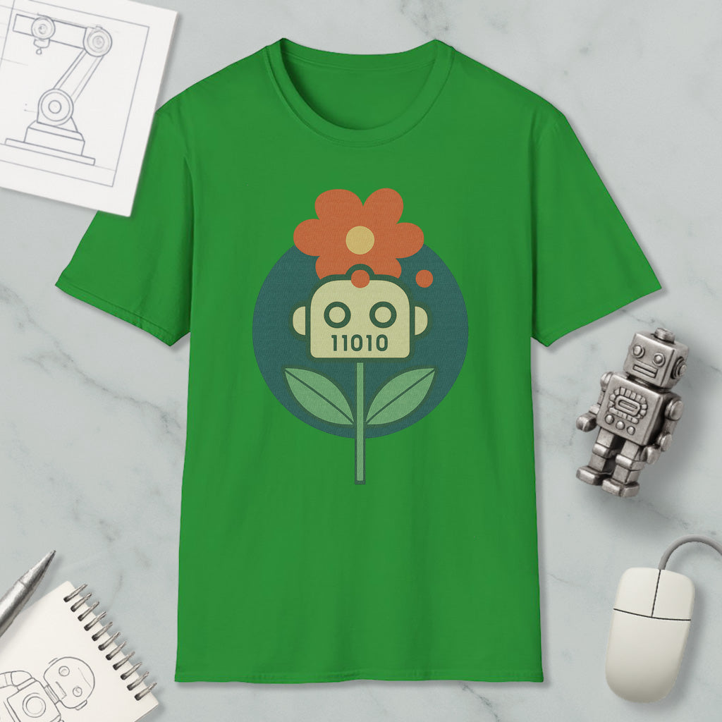 a green t-shirt with a graphic design of a flower and a robot, along with various objects such as a computer mouse, a notebook, and a robot figurine.