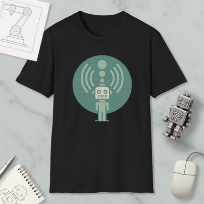 a black t-shirt with a graphic design of a robot, along with various objects such as a mouse, a notebook, and a pen.