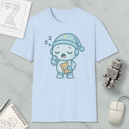 A light blue t-shirt with a cartoon robot wearing a blue hat and holding a teddy bear, along with a computer mouse and a robot toy, all placed on a marble surface.