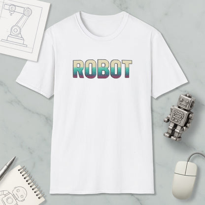 a white t-shirt with the word "ROBOT" printed on it, along with a small robot figurine and some other items such as a computer mouse and a notebook.