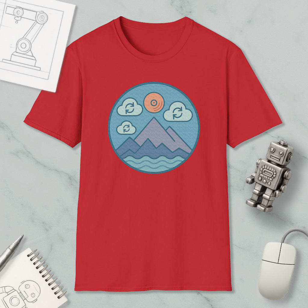 a red t-shirt with a graphic design of mountains, clouds, and a sun, along with a computer mouse and a robot figurine.