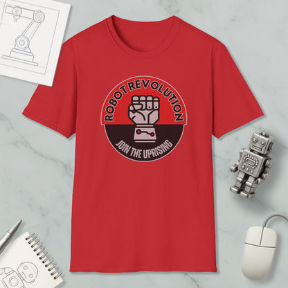 a red t-shirt with a graphic design, a computer mouse, a notebook, and a small robot figurine.