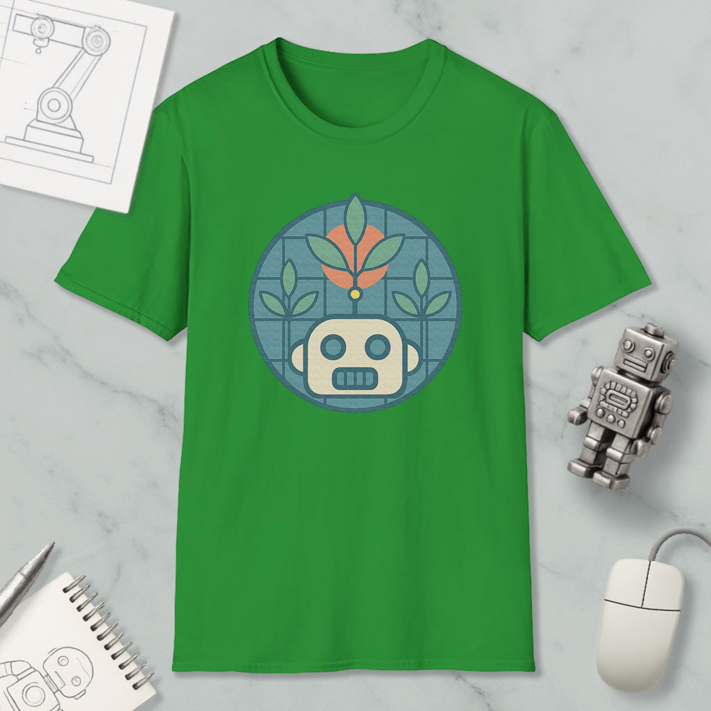 a green t-shirt with a graphic design of a robot or robot-like figure, surrounded by various objects such as a computer mouse, a notebook, and a pen.