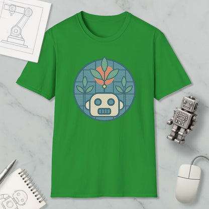 a green t-shirt with a graphic design of a robot or robot-like figure, surrounded by various objects such as a computer mouse, a notebook, and a pen.